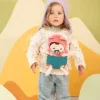 Lalka dzidziuś w nosidełku i z czapeczką Jeanne 18 m+