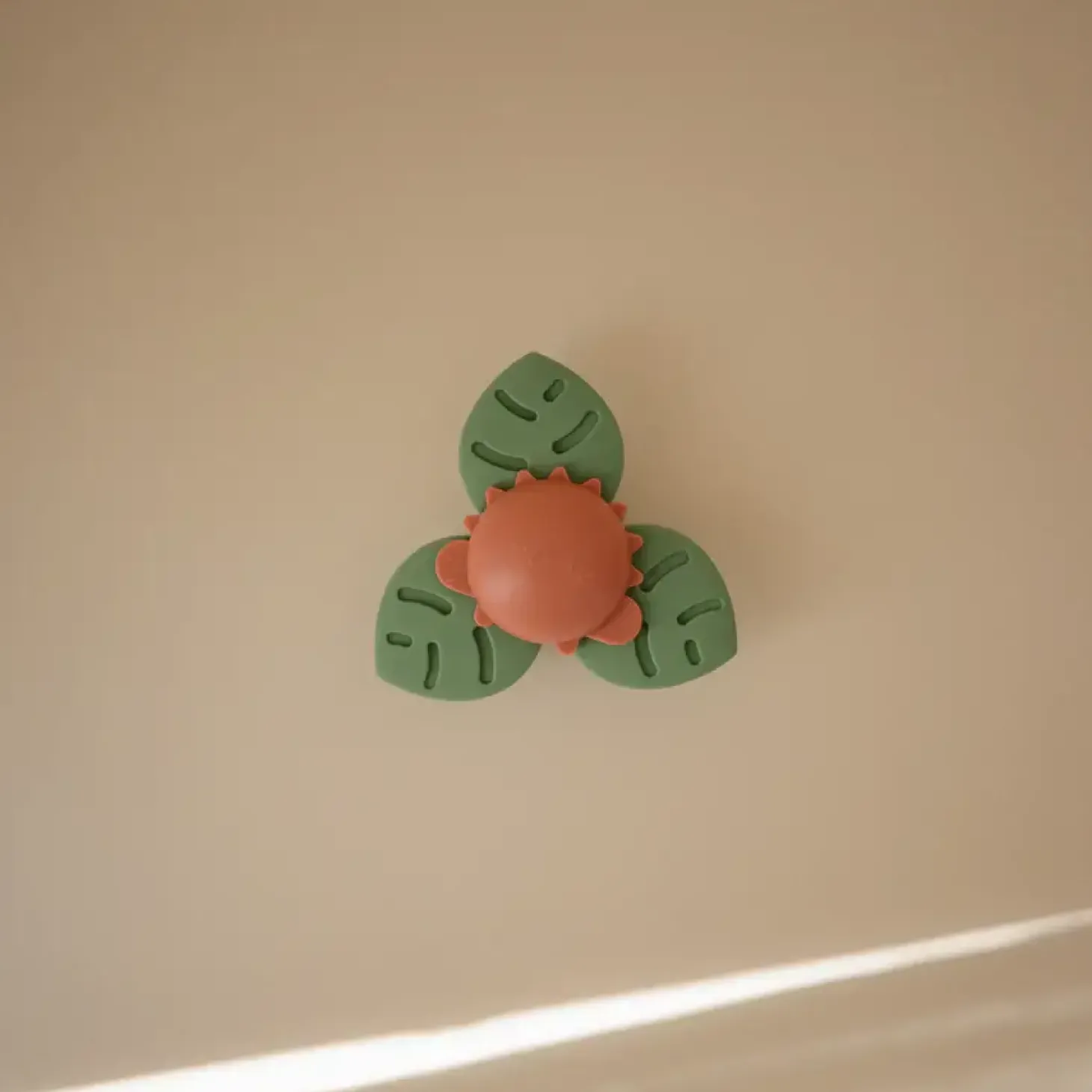 Spinner sensoryczny z przyssawką - Dino